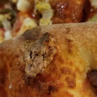 Chopped up cheap frozen hamburger patty