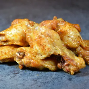 a pile of chicken wings