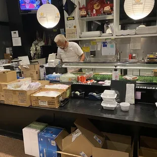 a man preparing food in a restaurant