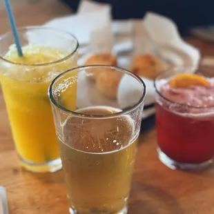 Drinks - left to right - passion fruit caipirinha, calidad - Mexican lager, hibiscus margarita.