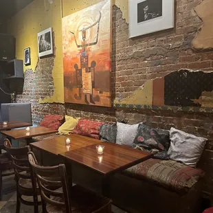 a dining area with a table and chairs