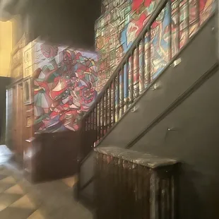 a hallway with graffiti on the walls