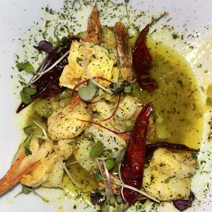 a plate of food with shrimp and vegetables