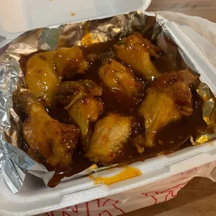 The wings are drowning in sauce