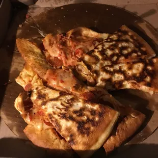 a half eaten pizza in a box