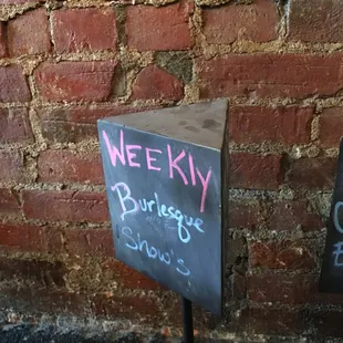 a chalkboard with the words weekly