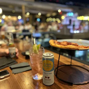 a beer and a pizza on a table