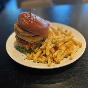 a burger and fries on a plate