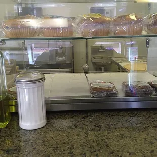 a counter with a variety of baked goods