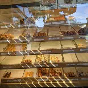a display case filled with donuts