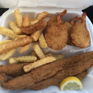 fried fish, fries, and lemon wedges