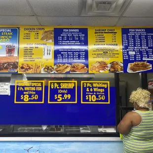 a woman ordering food at a restaurant