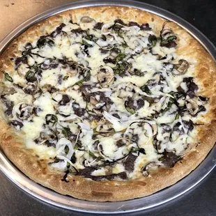 a pizza with mushrooms and cheese
