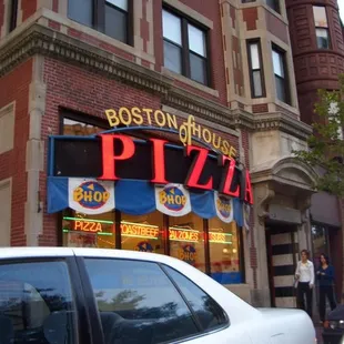 a car parked in front of a restaurant
