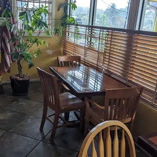 a dining room with a table and chairs