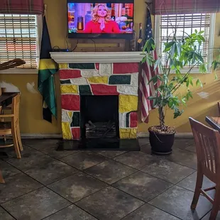 a flat screen tv above a fireplace