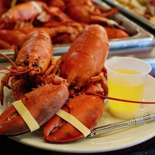 a plate of cooked lobsters