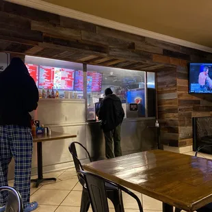 a man standing in front of a tv