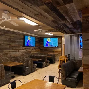 two televisions on the wall