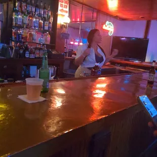 a woman sitting at a bar