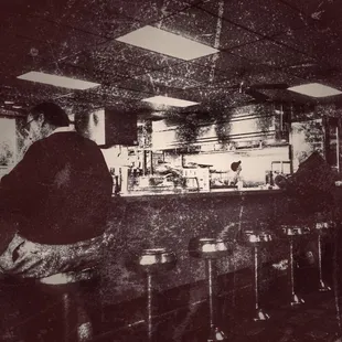 a man sitting at the counter