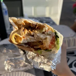 a hand holding a wrap