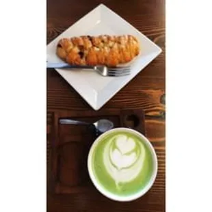 a plate of croissants and a cup of green tea