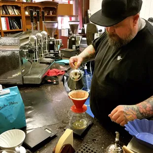 Serving me up a delicious complimentary cup of coffee!