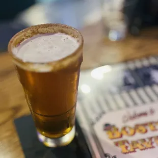 a pint of beer on a coaster