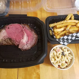 Prime rib, fries and macaroni salad.