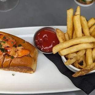 Classic Hot Lobster Roll**  (served with choice of salad, house chips or fries) $35