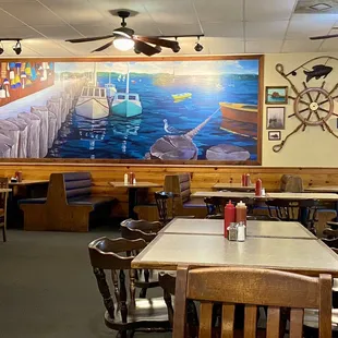 a dining room with tables and chairs
