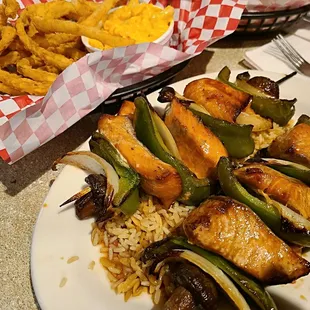 Teriyaki salmon skewers, served over rice, plus comes with 2 sides - 2 for $21.49