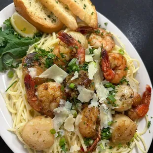 a plate of pasta and shrimp