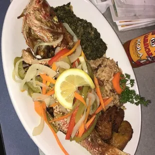 Whole Escoveich Fish with Callaloo &amp; rice and peas. I loved every bite.
