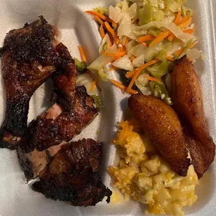 Jerk Chicken, macaroni and cheese and cabbage