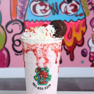 a milkshake with a cookie on top