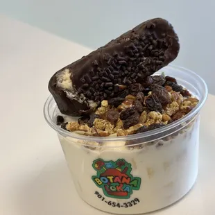 a yogurt with chocolate and granola