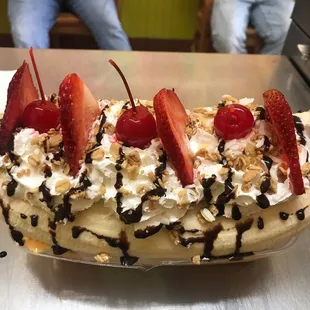 a banana split with strawberries and chocolate