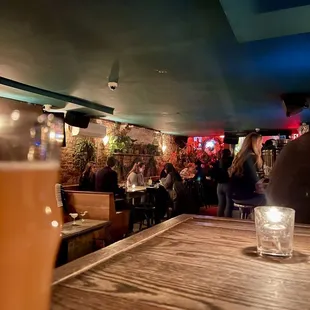 a pint of beer on a wooden table