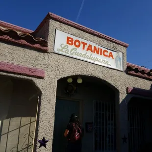 a woman standing in front of a building