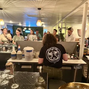 a bartender at the bar