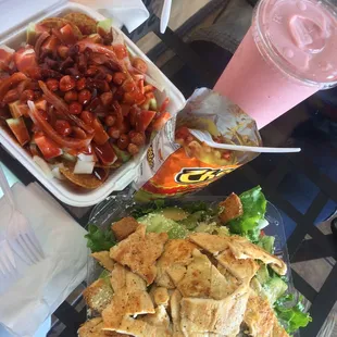 Tostilocos, hot cheetos with cheese, chicken caesar salad, and a smoothie