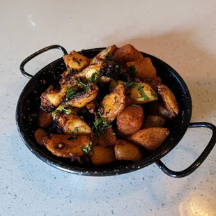 Grilled octopus with potatoes.