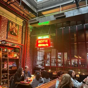 people sitting at tables in a restaurant