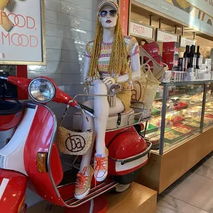 Noodle hair hipster scooter chick.