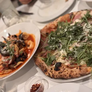 Seafood pasta and artichoke pizza
