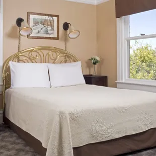 Rodey room on second floor is a small room with brass queen bed, private bath with shower. Great sunset view.