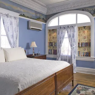 Cristy Room on main floor has king bed plus extra twin bed, full private bath, wall mural from 1930's.