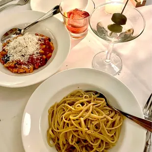 a plate of pasta and a glass of wine